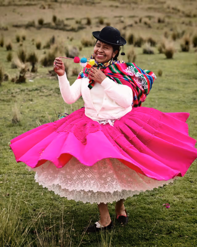 Quechua woman dancing the tarkada to the rhythm of the wichi-wichi