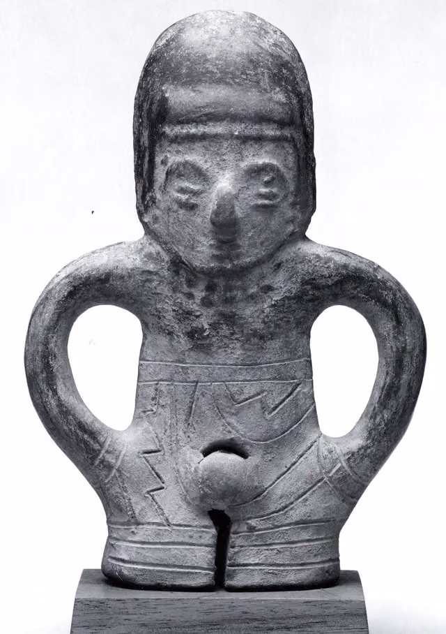 Ceramic whistle in the form of a standing figure