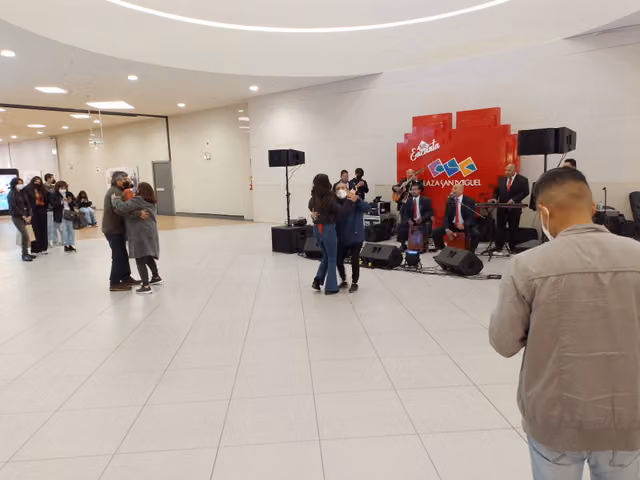 People dancing beside a criolla jarana