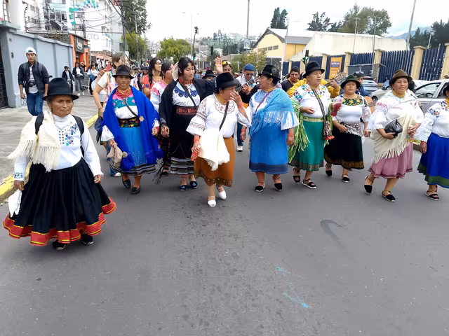 Indigenous women dancing in the Inti Raymi festival in the streets of Quito, Ecuador