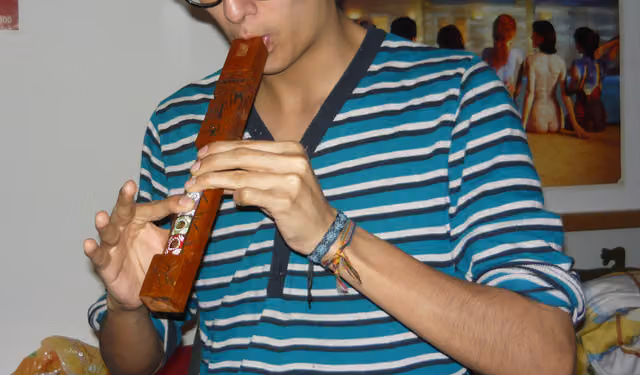 Young man playing the tarka