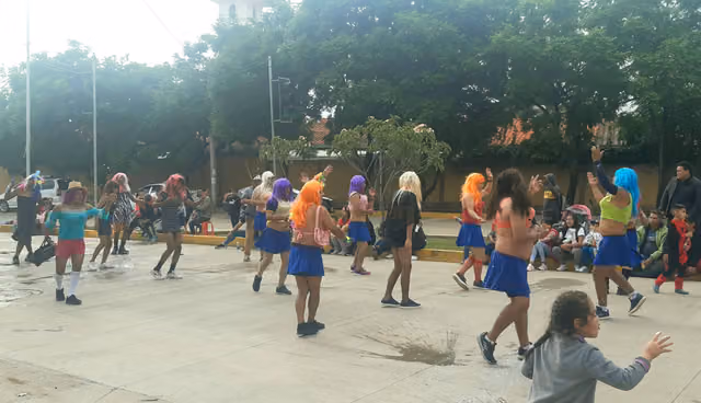 Men dressed as women dancing at the carnival of northern Cochabamba