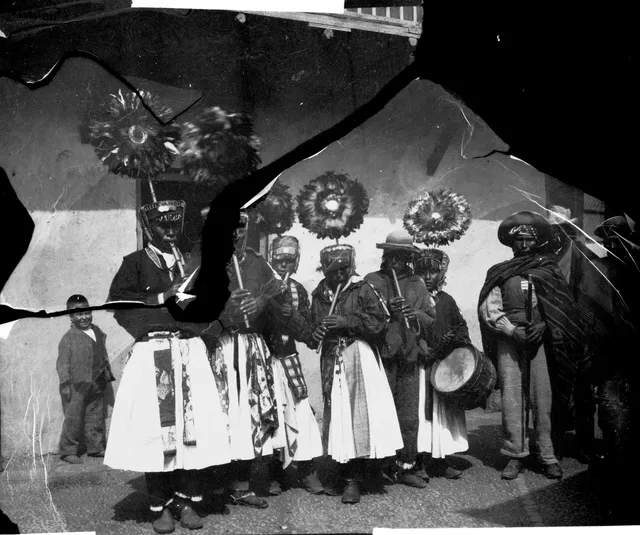 Ceremonially dressed Indigenous people outside a church, Pelechuco, Bolivia (SMVK 002450)