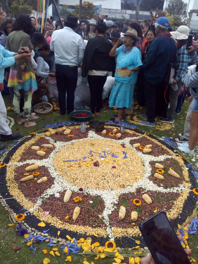 Sun represented on the ground with harvest products for the festival