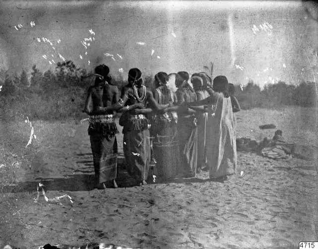 Nivaclé Indians dancing, holding one another