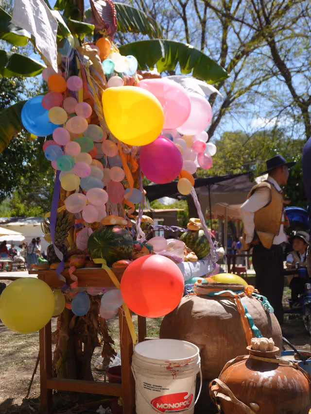 All Saints' altar with chicha and balloons in Aiquile