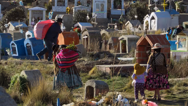 People at the Villa Ingenio cemetery on All Saints' Day