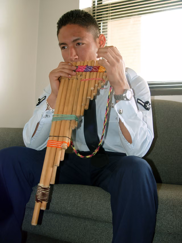 Airman Fredy Pasco playing the zampoña