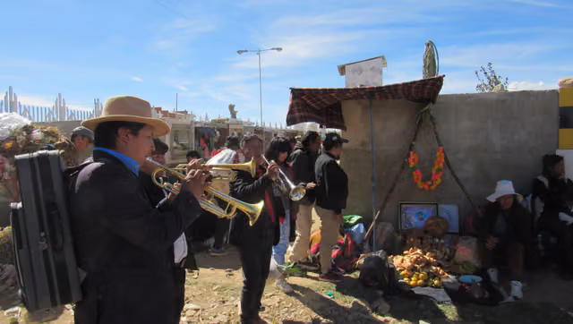 Musical band playing at a table, Mercedario zone, All Saints' Day
