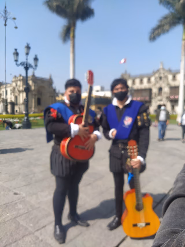 Two young members of the Universidad de Tacna tuna