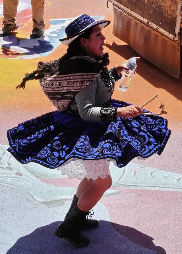 Kullawada dancer in blue and black printed pollera, Candelaria 2026, Puno