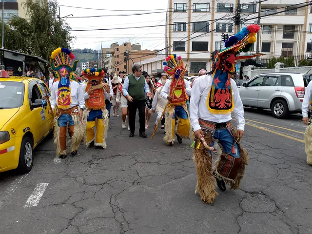 Characters of «Aya Uma» walking in the Inti Raymi festival in the streets of Quito, Ecuador