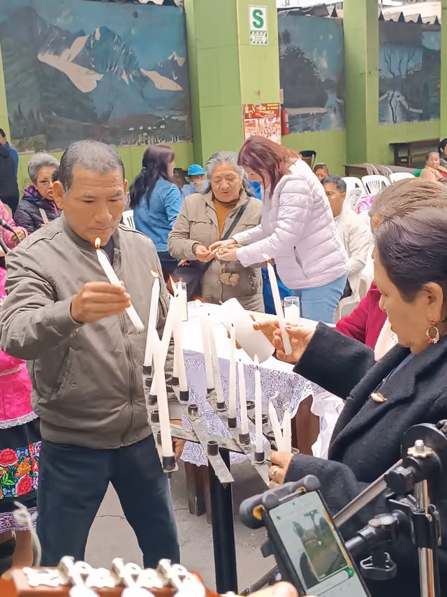 Followers of the Virgin of Candelaria light candles