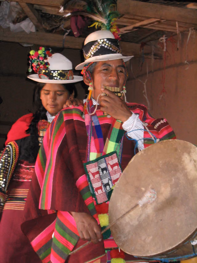 Two Quechua people with siku and caja