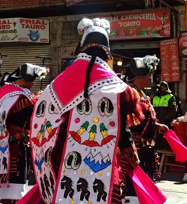 Pujllay dancer seen from behind