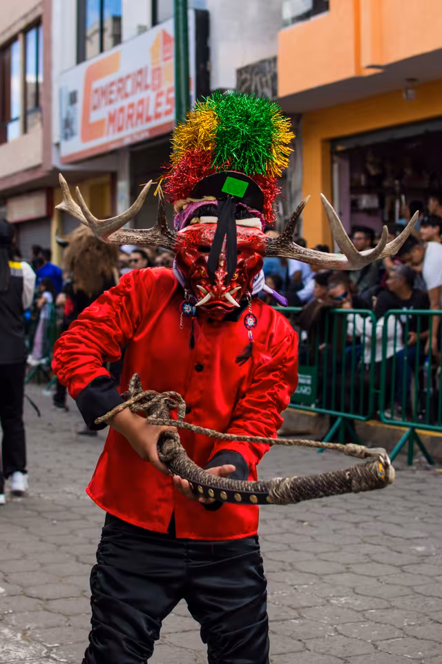 Diablada Pillareña dancer preparing the whip movement