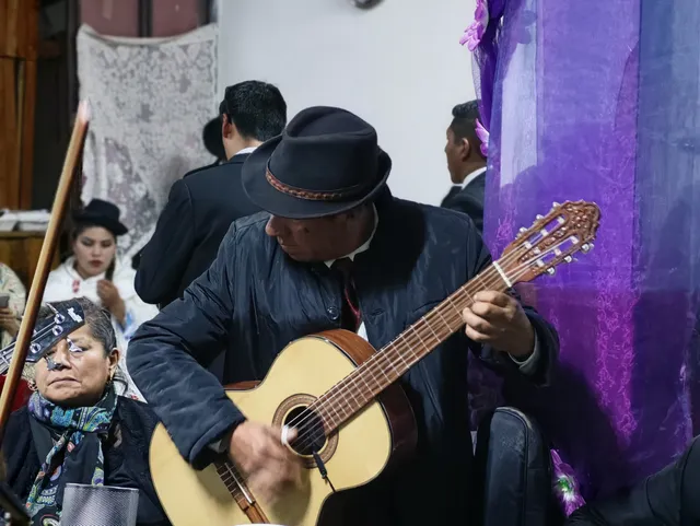 Estudiantina guitarist playing huayno pandillero