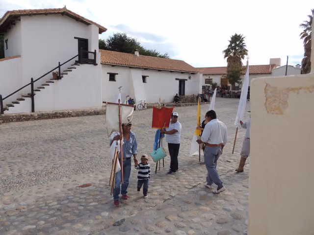 Alfereces with banners at the patron saint festival of Molinos (Salta)