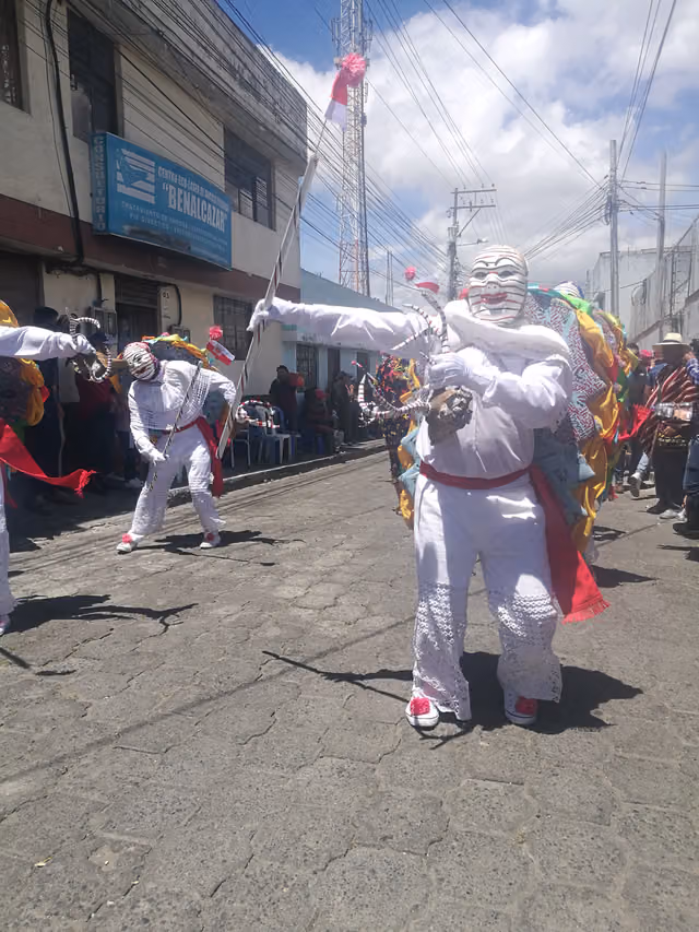 Masked dancers form their own comparsa