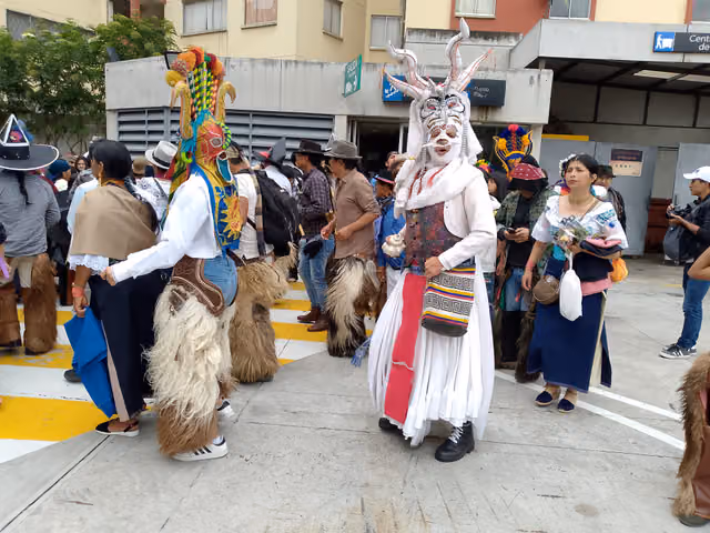 Characters of the Inti Raymi dancing in the yard of UASB, Quito