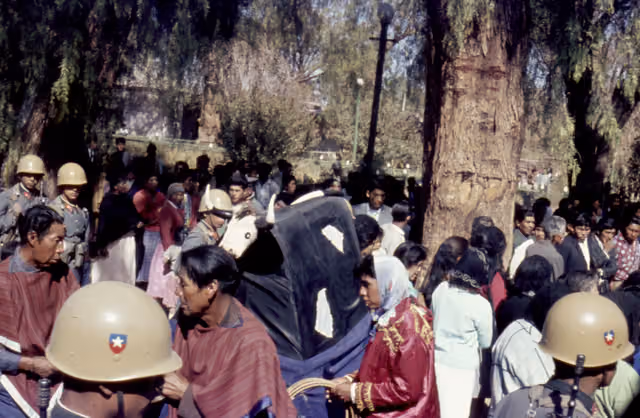 San Pedro de Atacama: group of people with a bull figurine at the Fiesta de San Pedro, 1966-1967