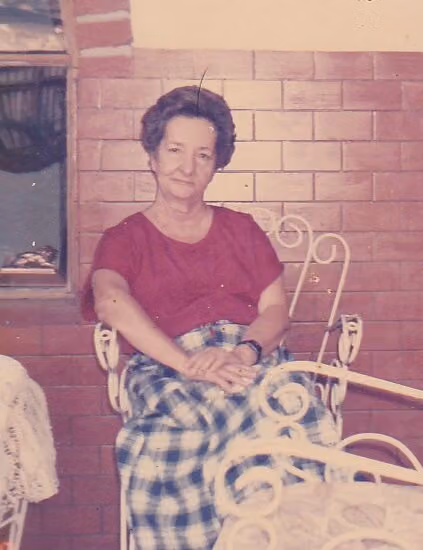 Gladys Moreno in the courtyard of her house