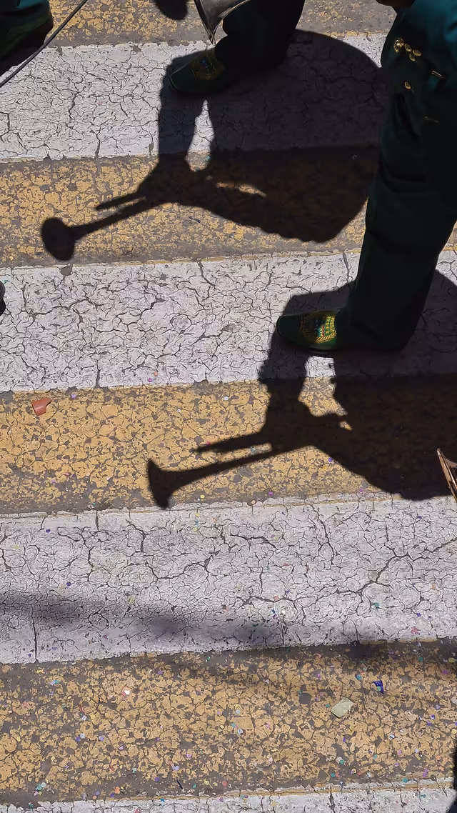 Shadows of trumpet players at the Oruro carnival (10)